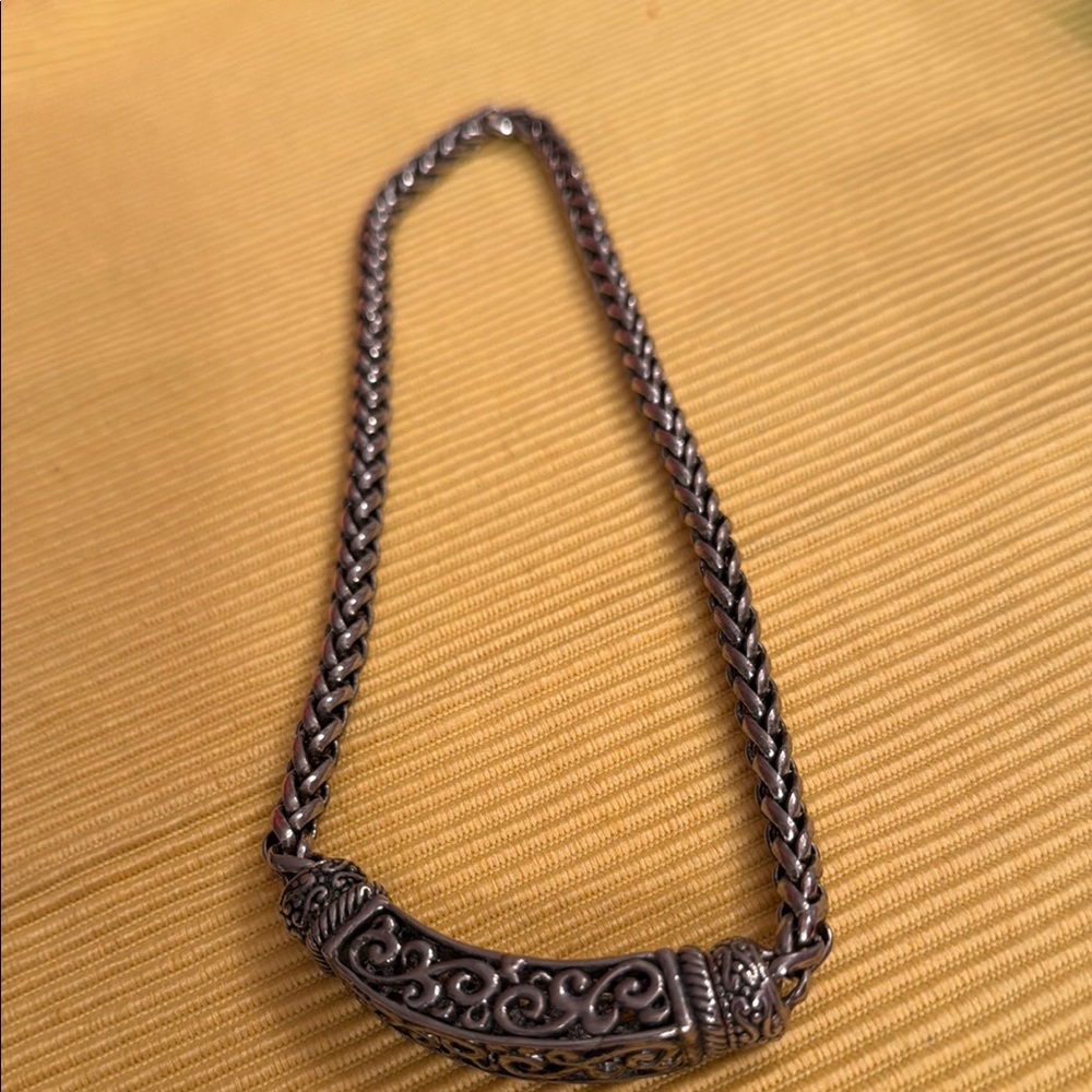 Silver Necklace with Ornate Centerpiece and Intricate Design